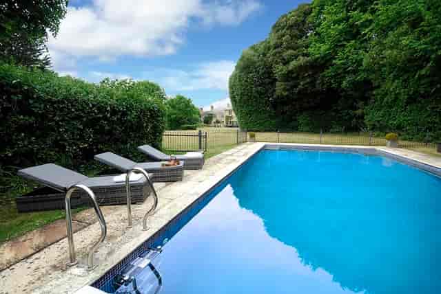Serene poolside at Haygrass House, ideal for outdoor events and summer gatherings.