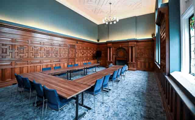 Classic boardroom, wood paneling, executive meeting, training event