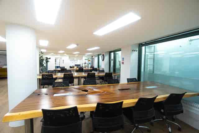 Camden Gateway APEX Boardroom: modern offsite meeting, wood table.