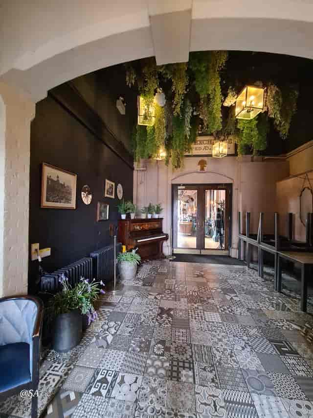 Glasshouse venue, green decor, live music event