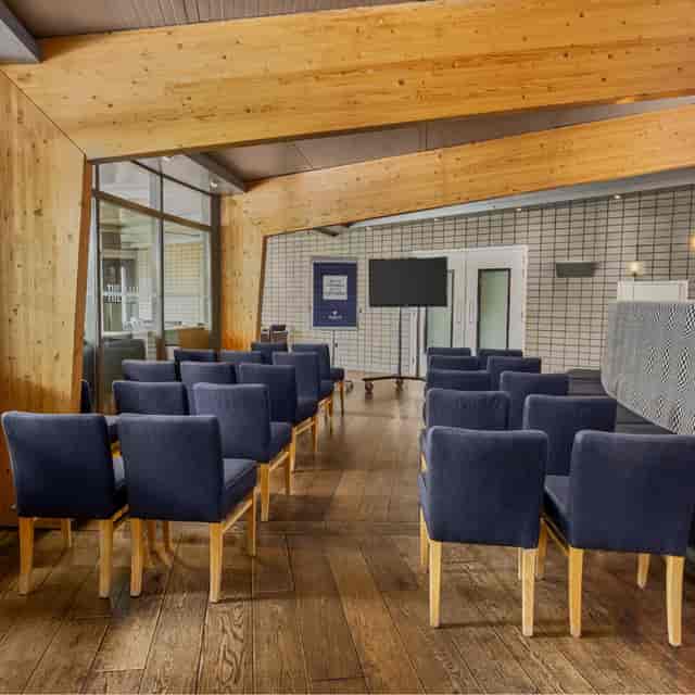 Modern Amsterdam meeting room, natural light, corporate event venue