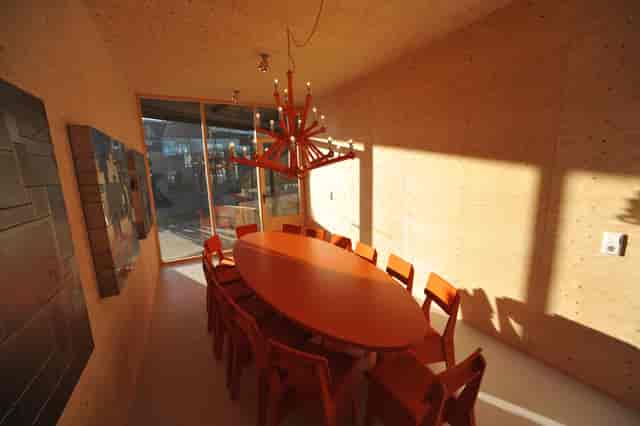 Orange meeting room, chandelier, executive board event