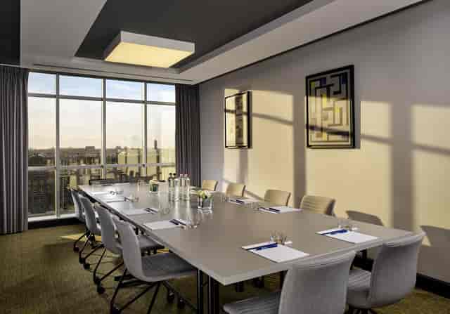 Park Plaza Utrecht boardroom, modern, executive meeting, strategy session