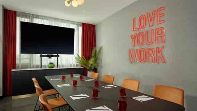 Berlin Garden Salon meeting with LOVE YOUR WORK sign, corporate event