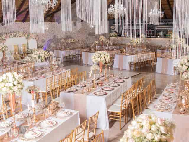 Elegant wedding venue, blush florals, gold accents, gala event