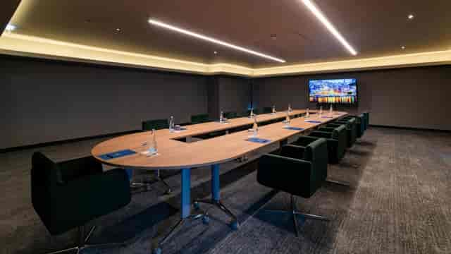 U-shape boardroom at Hilton Porto Gaia featuring wall display for corporate meetings and events.