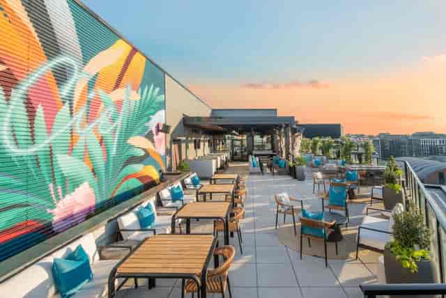 Rooftop deck with retractable roof at THRōW Social DC for cocktail receptions and networking events.