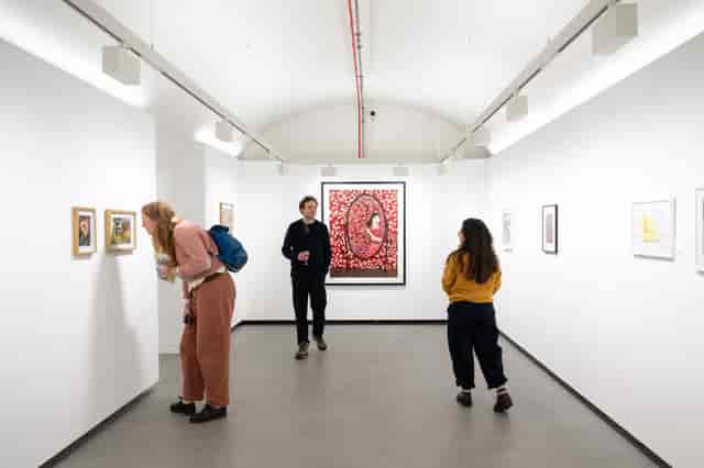 Minimalist art gallery, intimate reception space for VIP networking and exclusive gallery events.