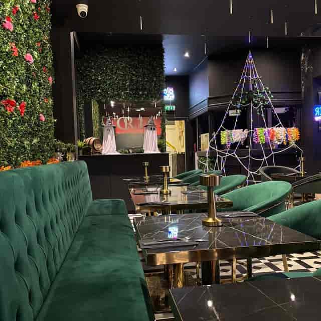 The Brasserie Halloween event: luxury velvet seating with kitschy decor for party venue hire.