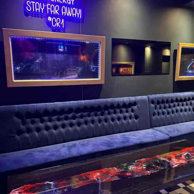 The Brasserie at CR1: Navy velvet banquette seating for upscale networking and evening events.