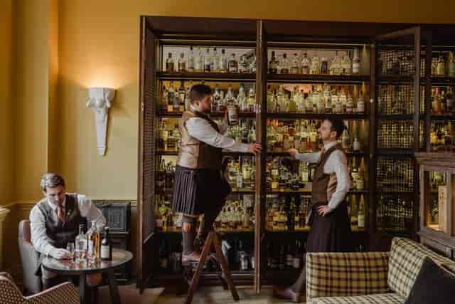 Spirit Safe Room with spirits display: upscale corporate reception and VIP networking venue.