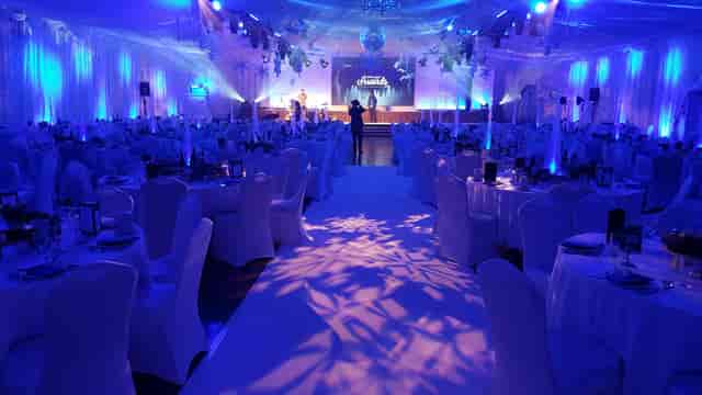 Bath Pavilion winter gala featuring blue uplighting and snowflake decor for corporate events.