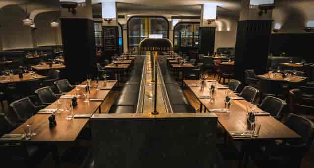 Sophisticated Hawksmoor Knightsbridge long-table setup for intimate corporate dinner events.