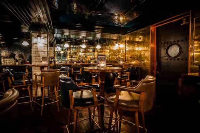 Hawksmoor Spitalfields Bar: plush leather seating for VIP receptions and networking events.