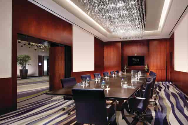 Executive boardroom at Vdara Las Vegas with crystal chandelier for luxury business meetings.