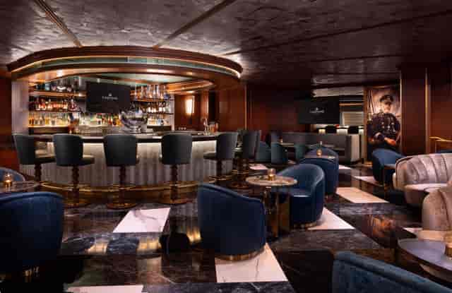 VIP lounge at The Beautiful Event Center featuring plush velvet seating for executive receptions.
