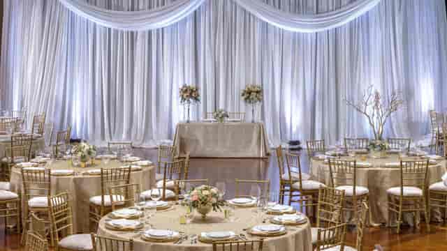 Elegant gala setup with gold Chiavari chairs at Railhead Boulder Station for wedding events.