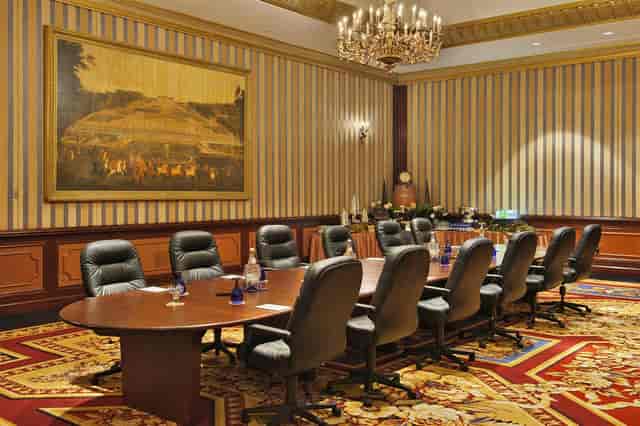 Paris Ballroom boardroom setup with executive chairs for luxury corporate events and conferences.