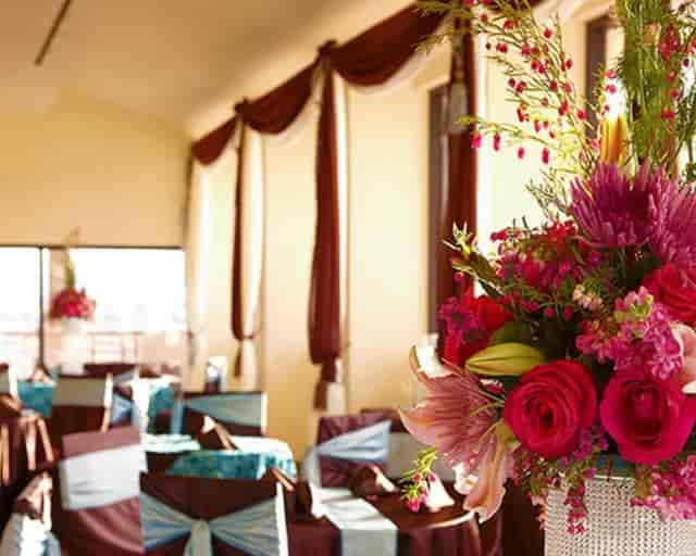 Tahiti Village Resort event venue with elegant draping and floral centerpieces for formal weddings.