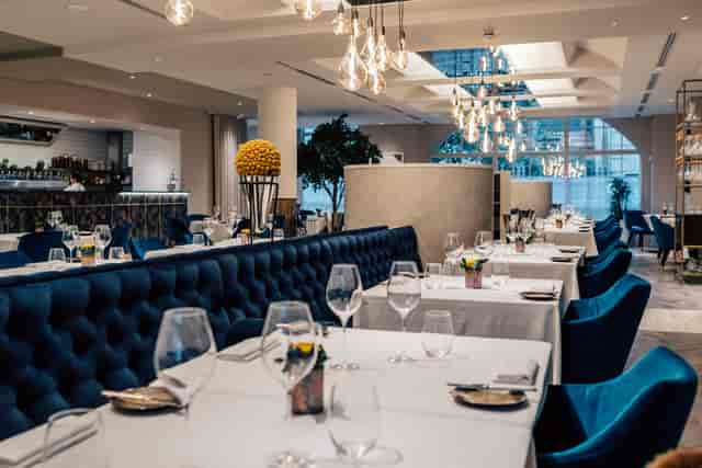 Viceroy dining room with tufted banquette seating for corporate dinners and VIP hospitality events.