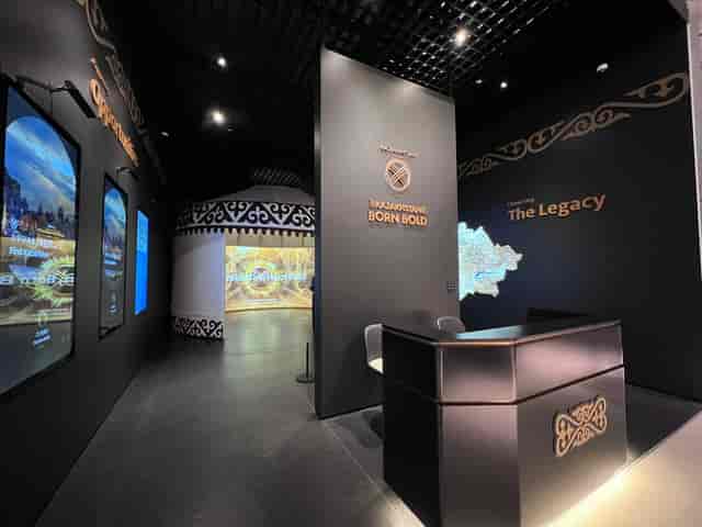 Modern exhibition booth at QazExpoCongress featuring minimalist design for trade shows and events.