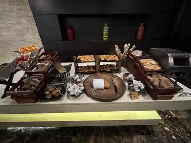 Continental breakfast buffet with wooden risers at DoubleTree Nairobi for corporate catering events.