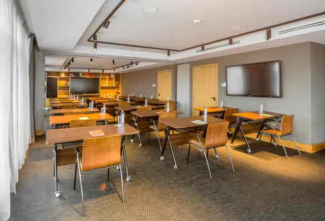 Modern boardroom at The Social House Nairobi with modular tables for workshops and training events.