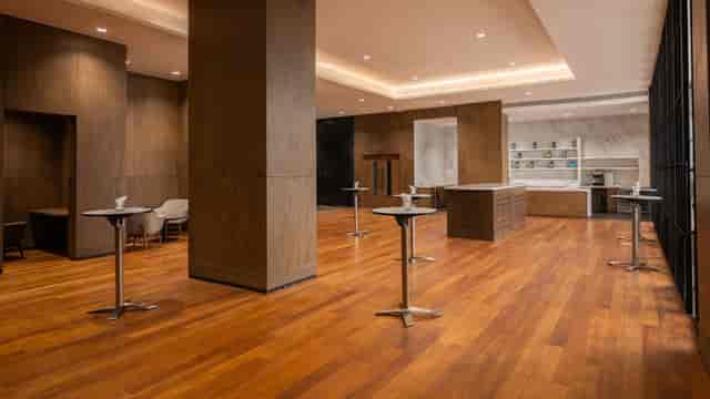 Regency Ballroom pre-function area with wood finishes for corporate events and cocktail receptions.