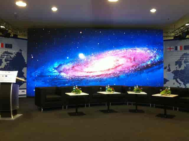 LED stage and lounge in Hall 11 ExpoGeorgia for professional panel discussions and tech events.