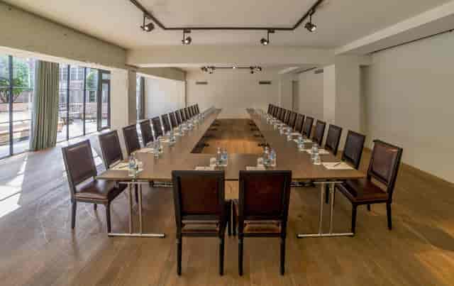 U-shape boardroom at Rooms Hotel Tbilisi, ideal for executive meetings and strategy sessions.