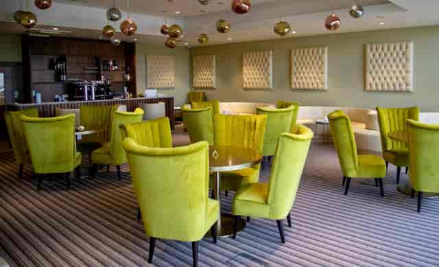 Rhema Suite pre-function lounge with bar seating for networking and corporate events.