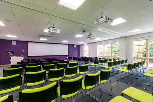 Saunders Room theater-style meeting space with natural light for corporate presentations and training.