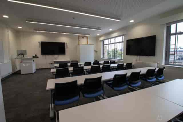 LOROS Centre IT training room with dual-screen setup for professional workshops and presentations.