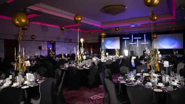 Grand Ballroom at Stormont Hotel with balloon decor for corporate awards and evening gala dinners.