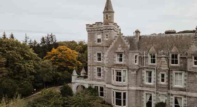 Ardoe House ballroom with historic architecture for luxury corporate retreats and weddings.