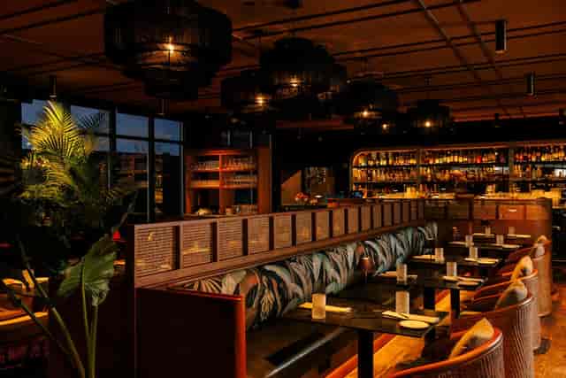 Main Indoor Lounge at Realm Rooftop Bar, plush seating for corporate reception and networking event.
