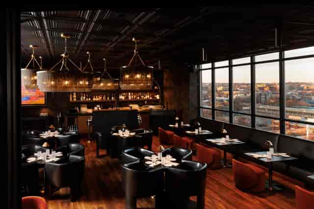 Private dining room at Realm Rooftop Bar with city views for executive networking and receptions.