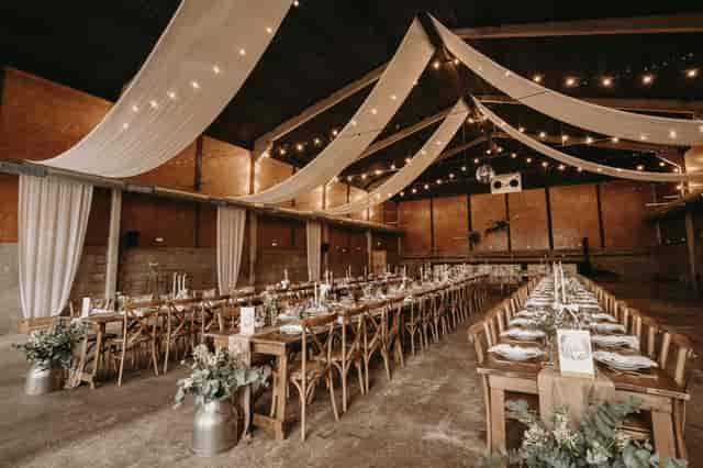 Rustic Boulton & Paul Bar with ceiling draping for industrial wedding venue and banquet events.