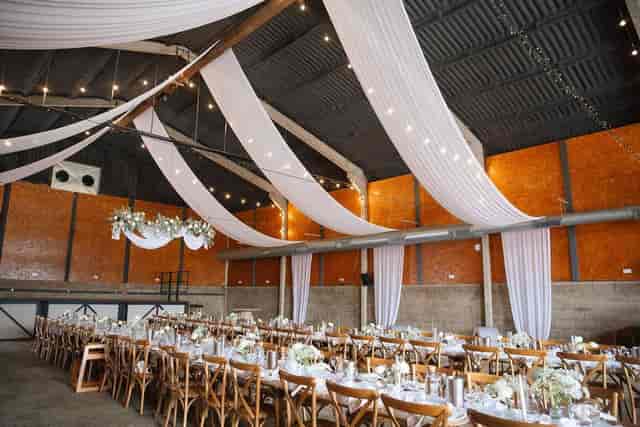 Boulton & Paul Bar wedding venue with fabric drapery for industrial banquet events.