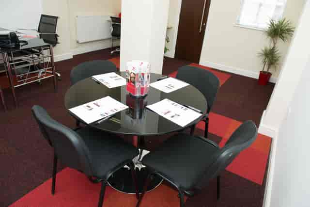 Compact breakout room with pillar for small group training and corporate workshop meetings.