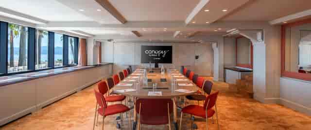 Retreat Room boardroom setup at Canopy by Hilton Cannes for executive meetings and corporate events.