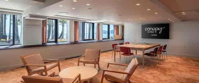 Orange Room meeting space at Canopy by Hilton Cannes with coastal views for board meetings.
