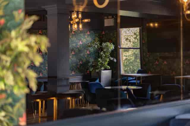 Tank Lounge at Zerodegrees with botanical decor, ideal for upscale corporate events and mixers.