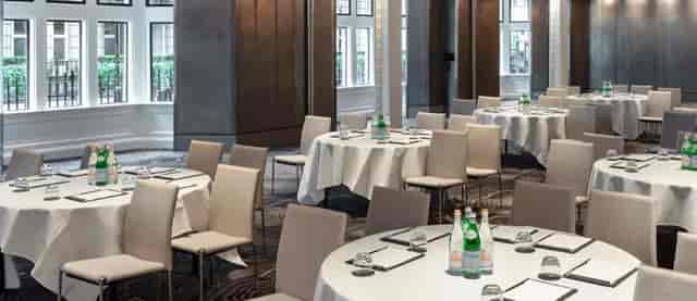 Folio Suite banquet setup with crisp white linens for corporate conferences and formal gala dinners.