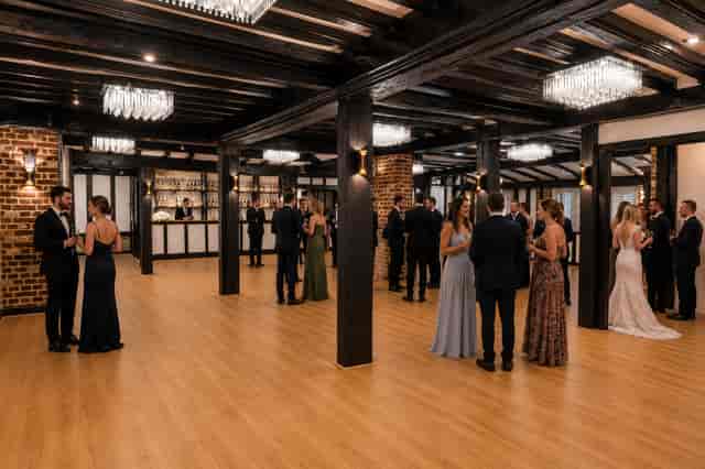 Cocktail reception in Chichester Suite with exposed brick; ideal for weddings and corporate events.