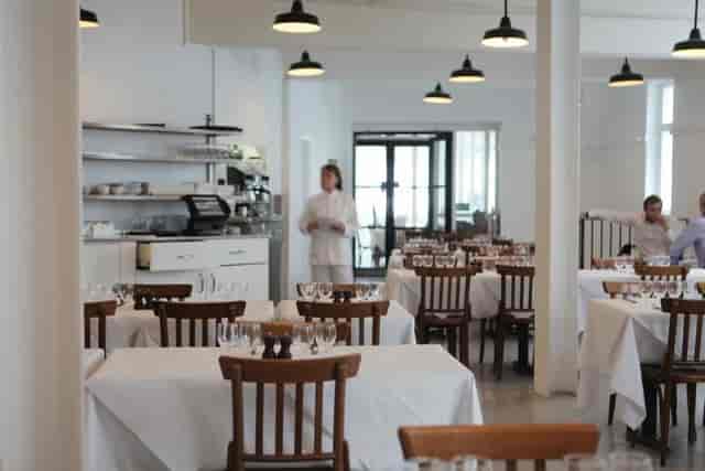 Exclusive Use dining at St. JOHN Bread & Wine, featuring white-linen corporate event venue.