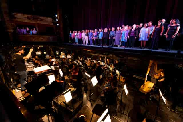Almeida Theatre auditorium with tiered stage design for live performance events.