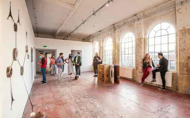 Main Gallery at BACKLIT: Industrial-chic art gallery space for event networking and exhibitions.