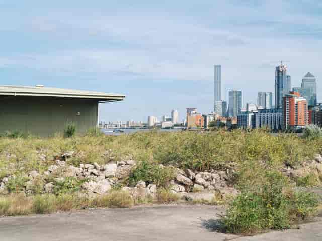 Industrial-chic waterfront venue in Deptford with Canary Wharf backdrop for brand activations.