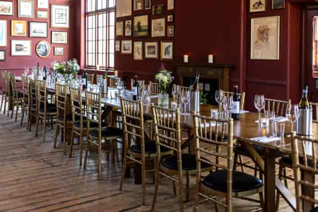 Private dining at One Over the Ait: gold chairs and long table for corporate events or luncheons.